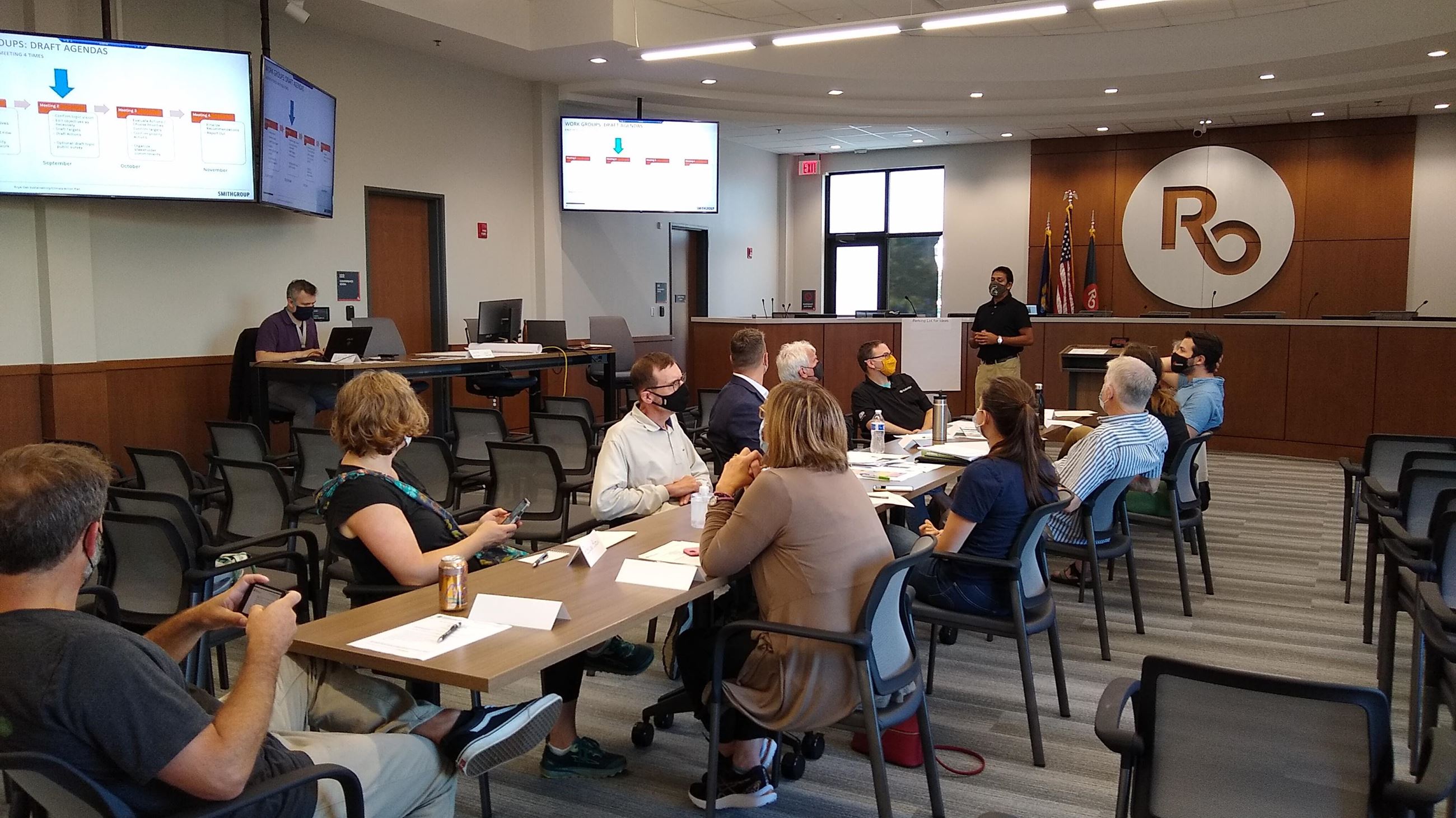 Royal Oak residents around a table at a meeting