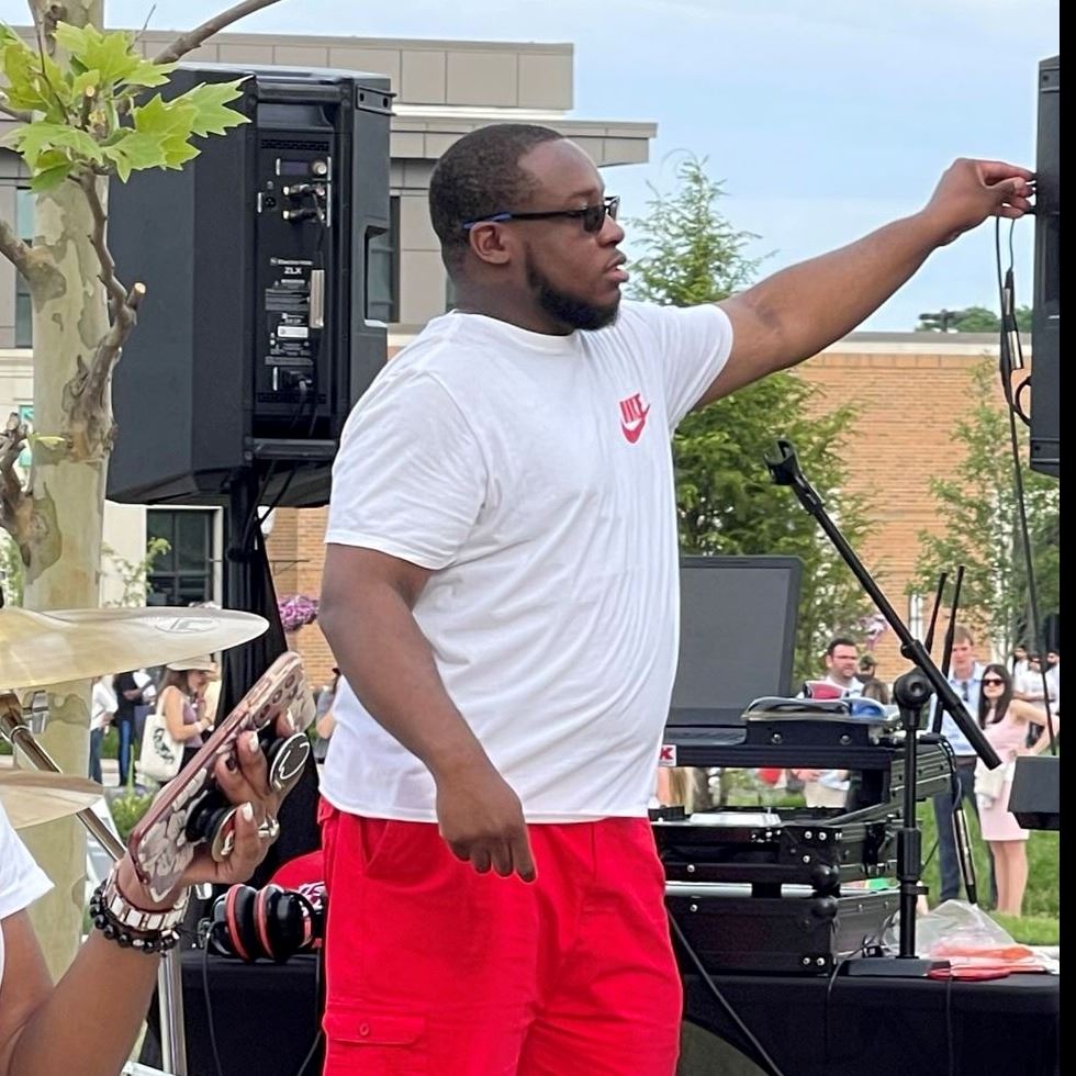 Disc Jockey, DJ Royal, plays music at the 2022 Juneteenth event.